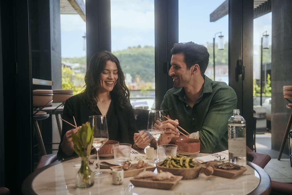 Radisson Collection Bilbao Hotel Restaurant photo A couple dining at a restaurant